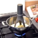The VIGOR Automatic Pan Stirrer is a cordless, battery-powered cooking accessory with nylon legs and 3-speed rotation—ideal for hands-free stirring of sauces, soups, and more.