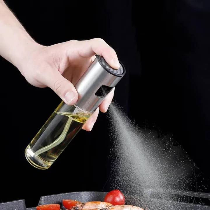 Glass olive oil sprayer with black push-top nozzle by Vigor Path
