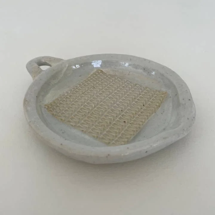 Neutral handmade Japanese ceramic grater with handle and spout